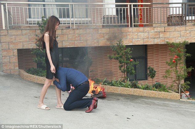 Desperate measures: The young wife was alleging burning her expensive bags as she threatened a divorce