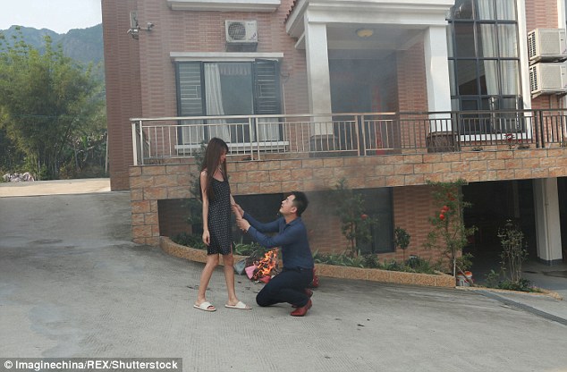 Please don't go: Chinese media claim the couple were having an argument outside their home in Guangzhou