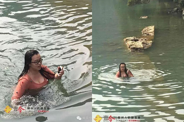  Cô gái bơi trở lại bờ với chiếc iPhone 5 lấy từ đáy sông lên. Ảnh: Shanghaiist 